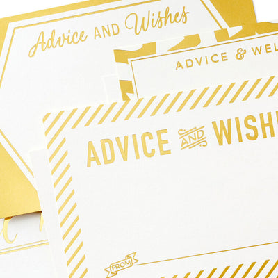 Gold foil flat note cards with white backgrounds and abstract borders, labeled “Advice and Wishes,” boxed with envelopes.
