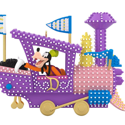 Hallmark Keepsake Disney Electrical Parade ornament featuring Mickey Mouse driving a purple train float with colorful lights and flags.