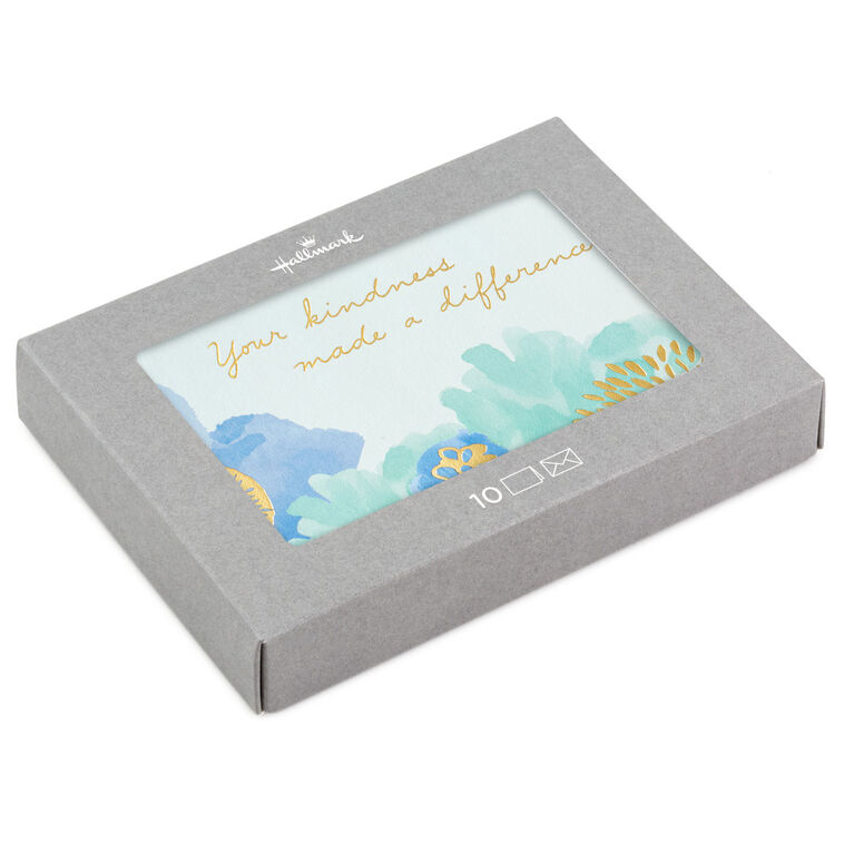 Blue and green floral watercolor thank-you cards with gold foil lettering, displayed in a gray gift box with matching white envelopes.