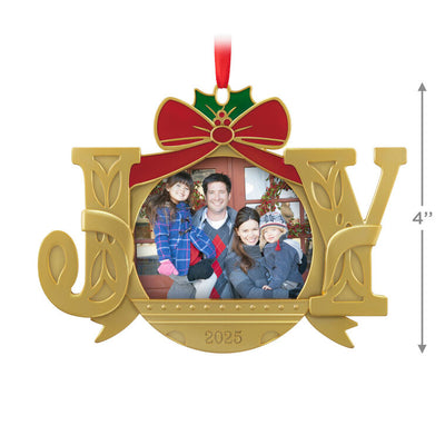 Gold JOY word-art photo frame ornament with red bow and holly topper, features 2025 date and holds a small holiday photo.