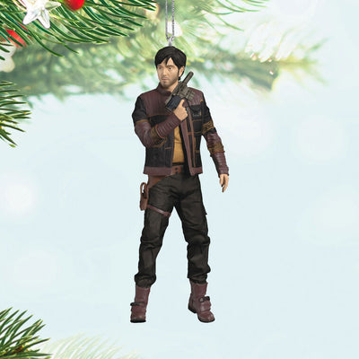 Cassian Andor Christmas ornament holding blaster, wearing brown tactical gear and scarf