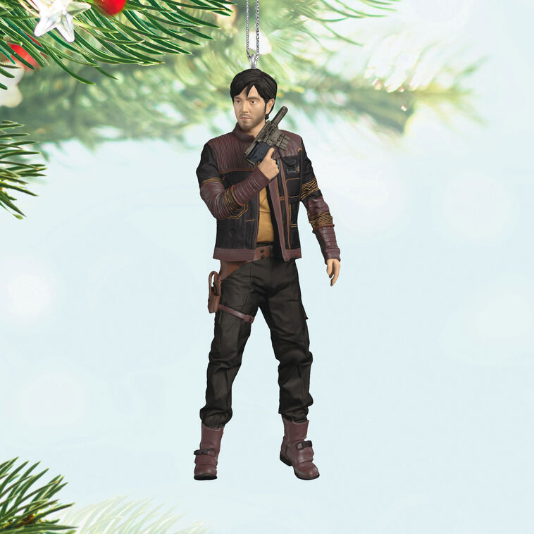 Cassian Andor Christmas ornament holding blaster, wearing brown tactical gear and scarf