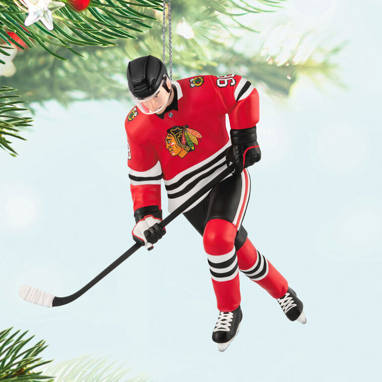 Connor Bedard ornament in Chicago Blackhawks jersey, number 98, action hockey pose, Hallmark NHL Christmas collectible for hockey fans
