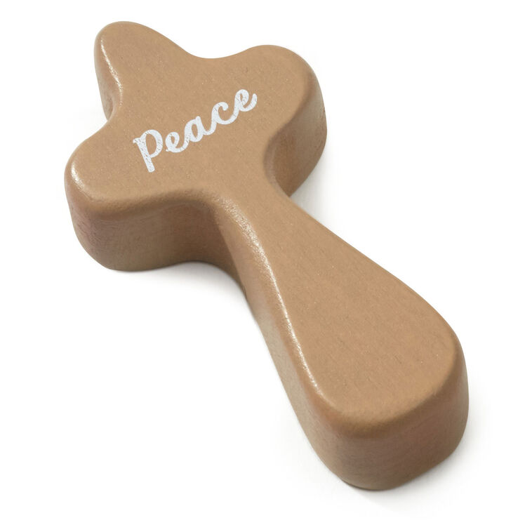 Hallmark Peace mini comfort cross with white text and John 14:27 Bible verse on light stained wood.