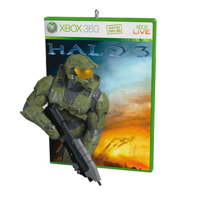 Halo 3 ornament, Master Chief with assault rifle, green disc case, orange sunset background, Hallmark Keepsake, Christmas tree decoration.