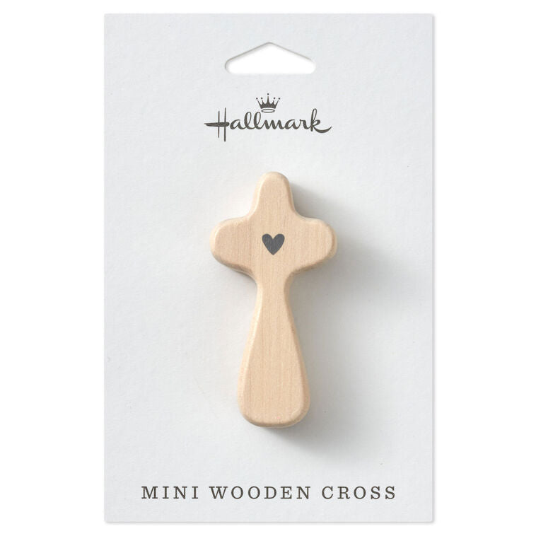 Hallmark mini comfort cross with gray heart design and I John 4:16 Bible verse on light wood.