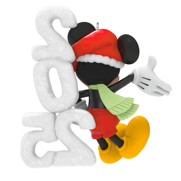Mickey Mouse in Santa hat and scarf smiles next to a glittery “2025” snow sculpture in this festive Hallmark Keepsake Disney ornament.