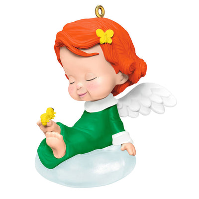 Hallmark Keepsake ornament of angel Hydrangea with red curls, green dress, white wings, holding a yellow caterpillar and butterfly