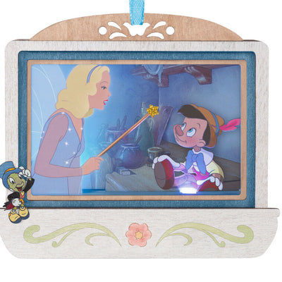 Disney Pinocchio 85th anniversary papercraft ornament with Blue Fairy and Geppetto’s puppet, lit with special effects.

