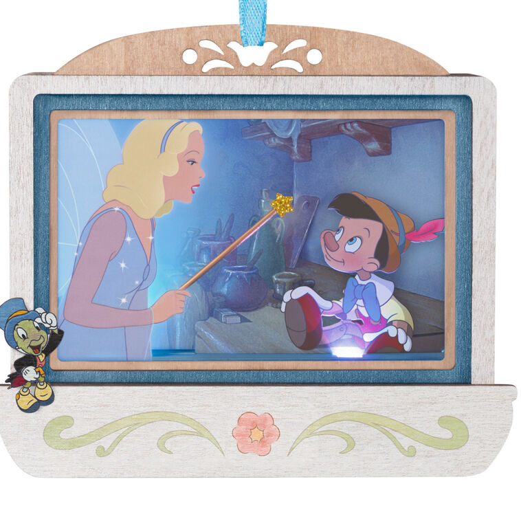 Disney Pinocchio 85th anniversary papercraft ornament with Blue Fairy and Geppetto’s puppet, lit with special effects.

