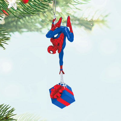 Spider-Man ornament, Marvel hero in red and blue suit, upside down, holding gift, Hallmark Keepsake Christmas decoration.