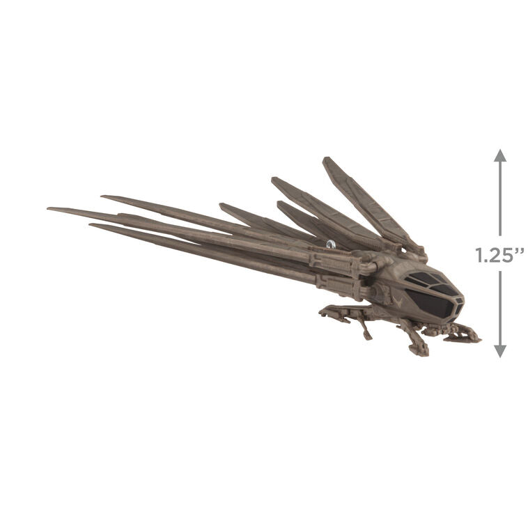 Die-cast Dune ornament of Atreides ornithopter aircraft with folding wings and bird-like shape.