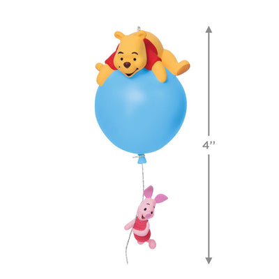 Hallmark Keepsake Disney Winnie the Pooh ornament, Pooh on blue balloon with Piglet hanging, light-up holiday tree decoration.