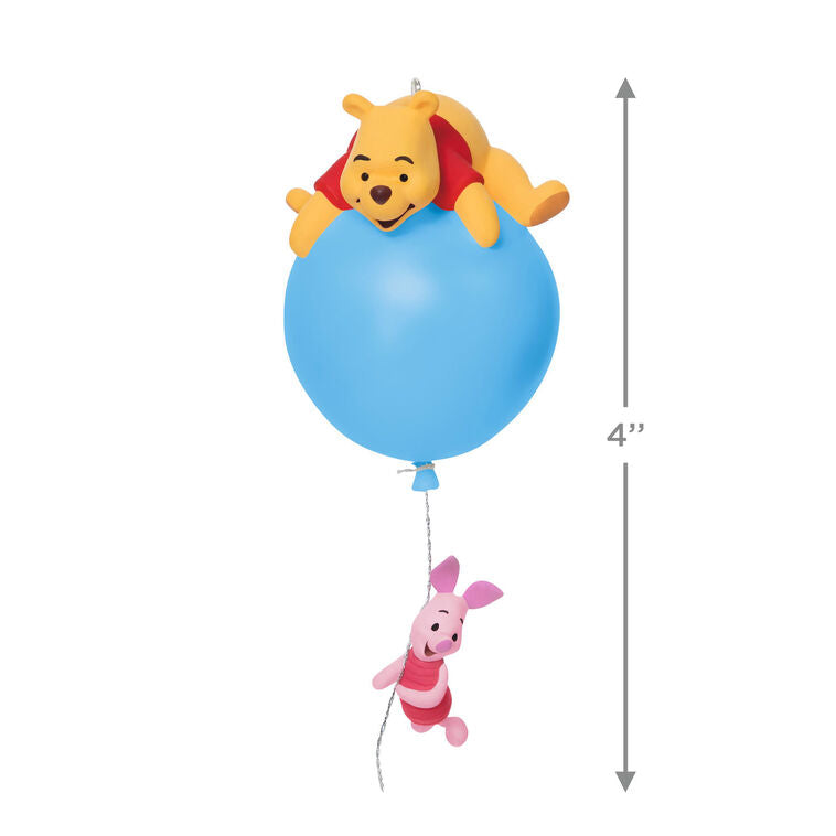 Hallmark Keepsake Disney Winnie the Pooh ornament, Pooh on blue balloon with Piglet hanging, light-up holiday tree decoration.
