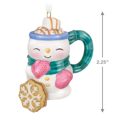 Porcelain ornament shaped like a snowman mug with scarf, pink mittens, marshmallow, caramel drizzle, and snowflake cookie, Hallmark Cup of Cozy series