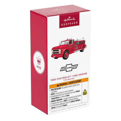 1968 red Chevrolet fire engine Christmas ornament with ladder details, turning wheels, and battery-powered light on front grill.