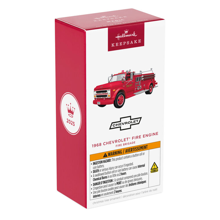 1968 red Chevrolet fire engine Christmas ornament with ladder details, turning wheels, and battery-powered light on front grill.