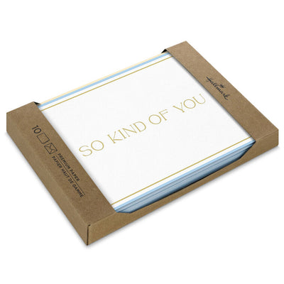 Elegant white thank-you cards with gold foil lettering, light blue border, and narrow gold frame.
