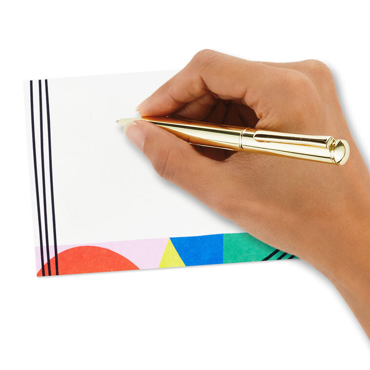 Flat note cards with colorful geometric border design and black parallel lines on white cardstock, wrapped in kraft band.
