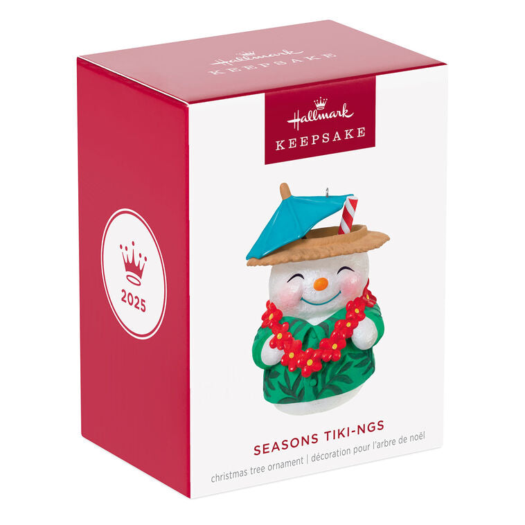 Snowman tiki drink ornament wearing green shirt and red lei with cocktail umbrella and striped straw, festive holiday decor

