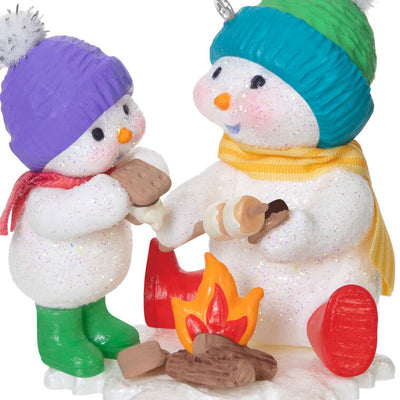 Hallmark Keepsake Making Memories Scrumptious S’mores ornament—two snowmen roasting marshmallows over campfire, winter hats and scarves