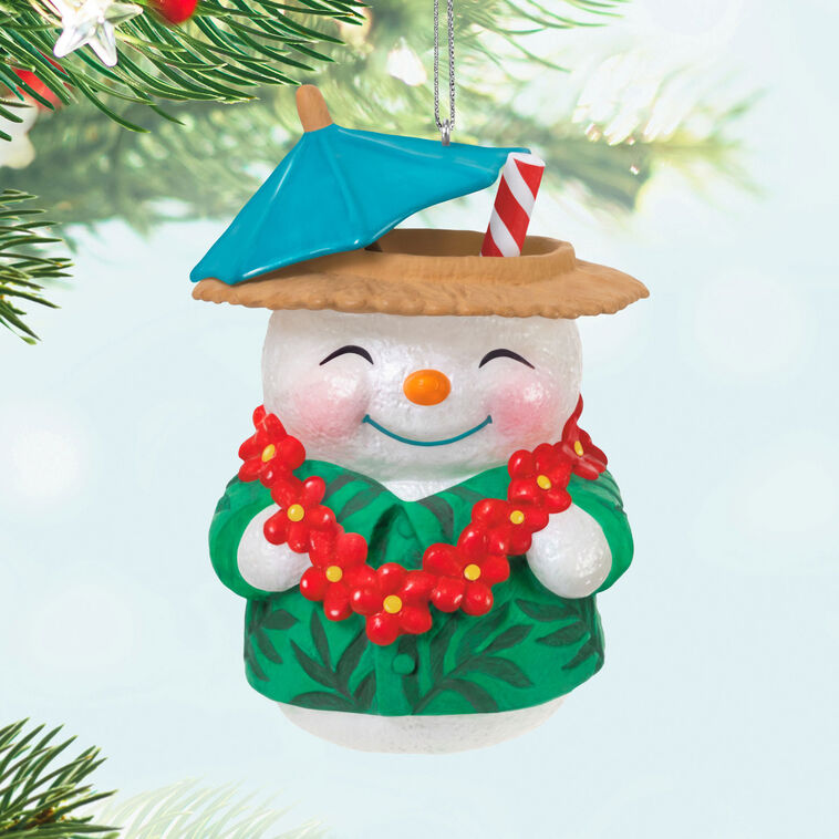 Snowman tiki drink ornament wearing green shirt and red lei with cocktail umbrella and striped straw, festive holiday decor

