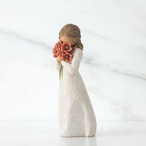 Willow Tree Surrounded by Love figurine holding red-orange poppy bouquet.