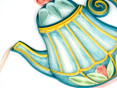 Quilled card with a striped teapot pouring tea into a cup, accented with roses—evoking calm, elegance, and shared moments.