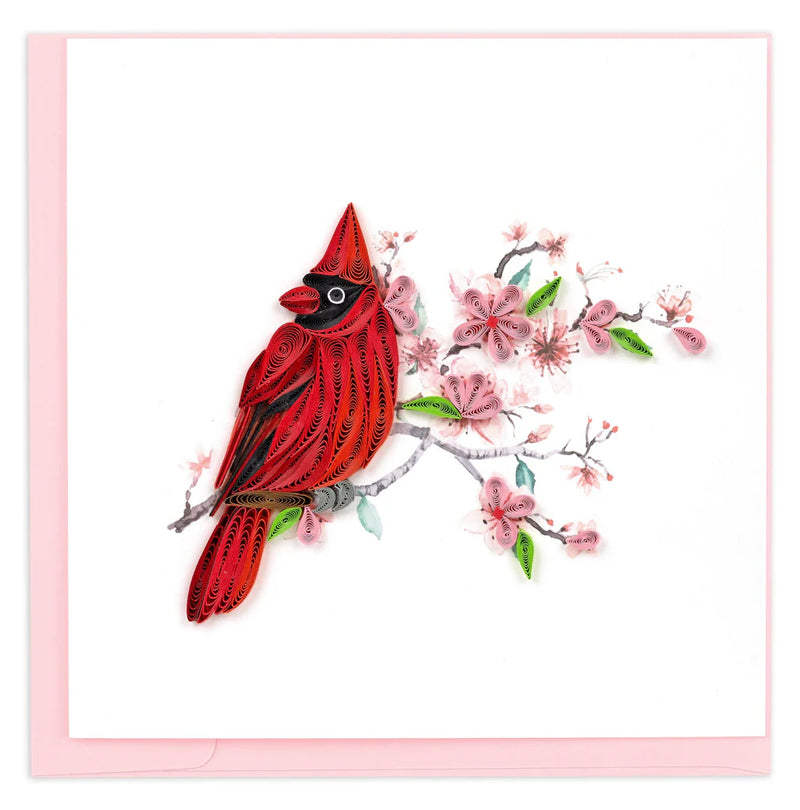 Quilled greeting card featuring a red cardinal perched among delicate pink cherry blossoms on a soft pastel background.