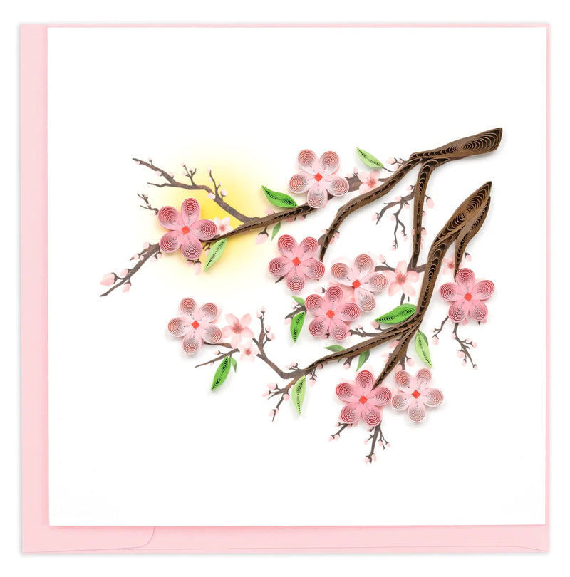 Handmade quilled card featuring pink cherry blossoms on tree branches, symbolizing renewal, spring, and beauty.