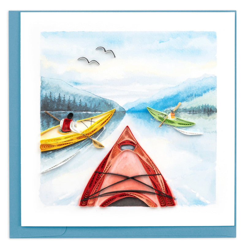 Handcrafted quilled card featuring colorful kayaks on a lake with distant pine trees and birds, evoking peace and outdoor adventure.