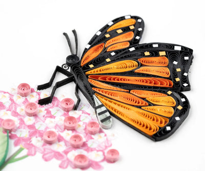 Quilled Monarch butterfly card featuring vibrant orange wings and pink milkweed flowers, perfect for nature lovers and occasions.