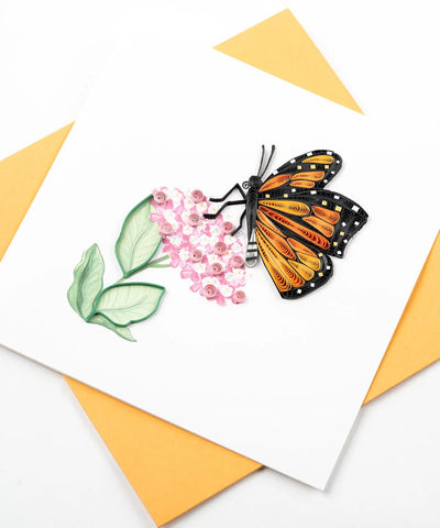 Quilled Monarch butterfly card featuring vibrant orange wings and pink milkweed flowers, perfect for nature lovers and occasions.