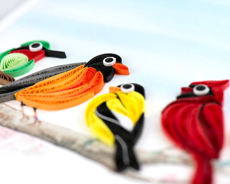 Quilled card with five colorful birds, including a cardinal and hummingbird, perched on a branch—symbolizing joy, unity, and nature&