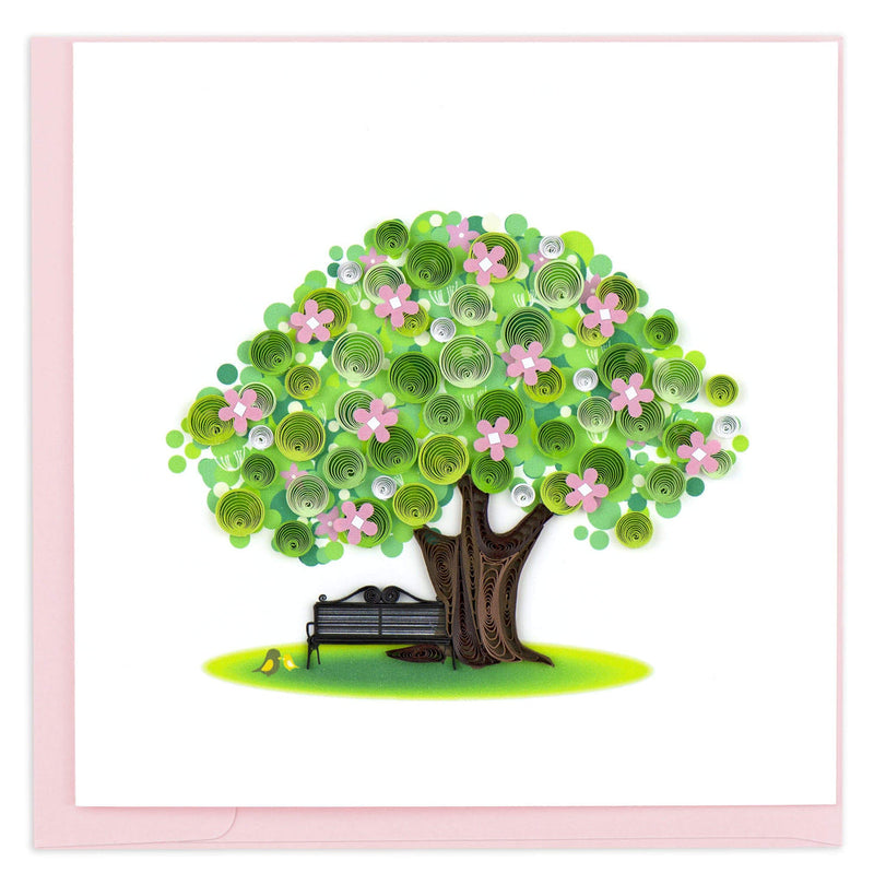 Quilled spring tree card with pink blossoms, a black park bench, and yellow birds—symbolizing renewal, serenity, and new beginnings.