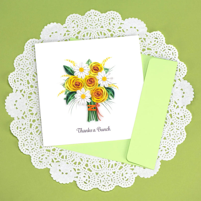 Handcrafted card with quilled yellow and white flower bouquet and “Thanks a Bunch” message. Light green envelope included.