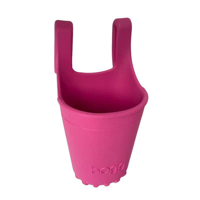 Bogg Bevy in Haute Pink, the perfect drink holder and organizer for Bogg Bags. Keep essentials like phone, keys, and snacks at hand while staying hydrated on the go.

