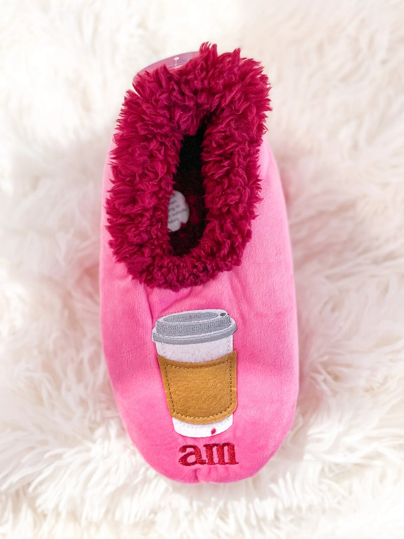 Pink cozy sherpa slippers with AM coffee and PM wine design, non-skid soles by Snoozies.
