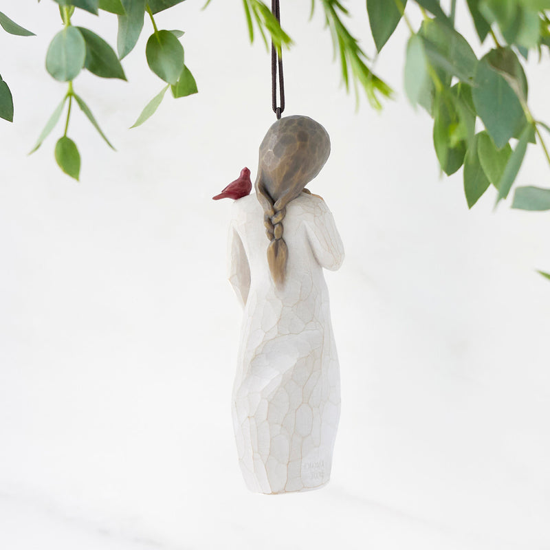 Willow Tree Messenger ornament featuring a woman in a cream dress with a red cardinal on her shoulder.