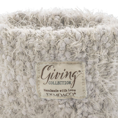 Cream fuzzy women’s socks with rubber grippers on the soles, ultra-soft and cozy, part of the Demdaco Giving Collection.