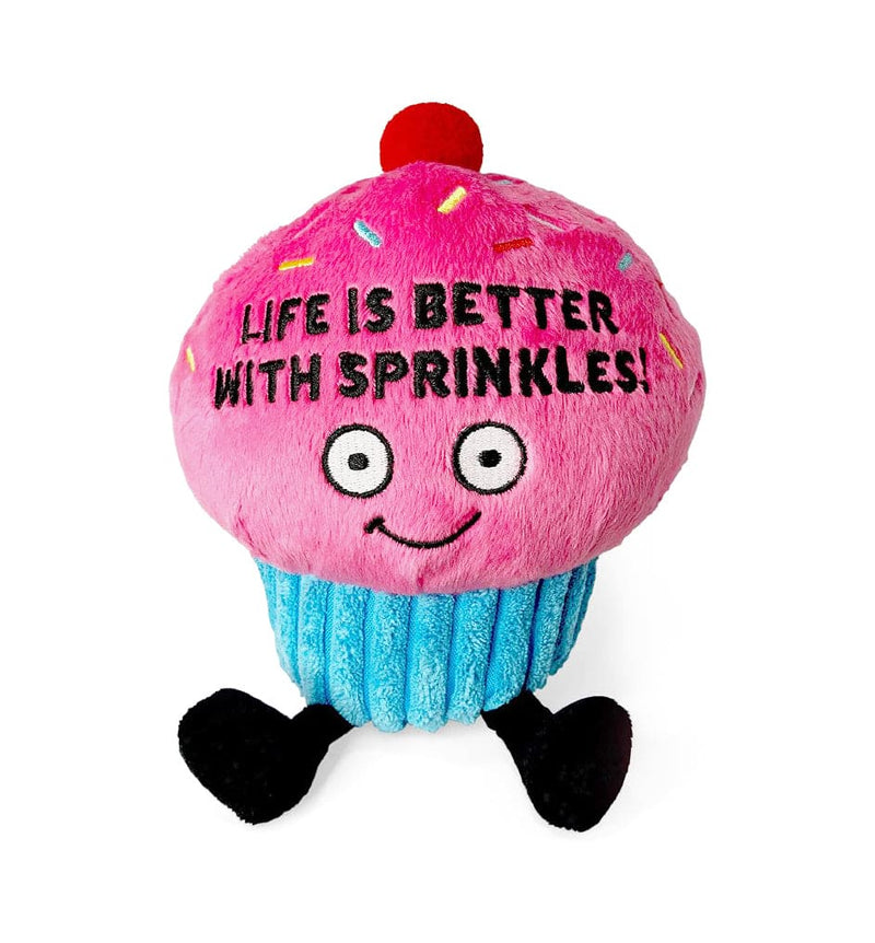 Cupcake plush with pink frosting, cherry top, and “Life Is Better With Sprinkles” embroidered message. Soft and free-standing.
