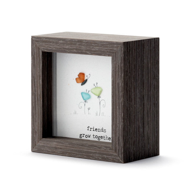 Decorative wooden shadow box with floral artwork and Friends Grow Together message, ideal for friendship gifts.