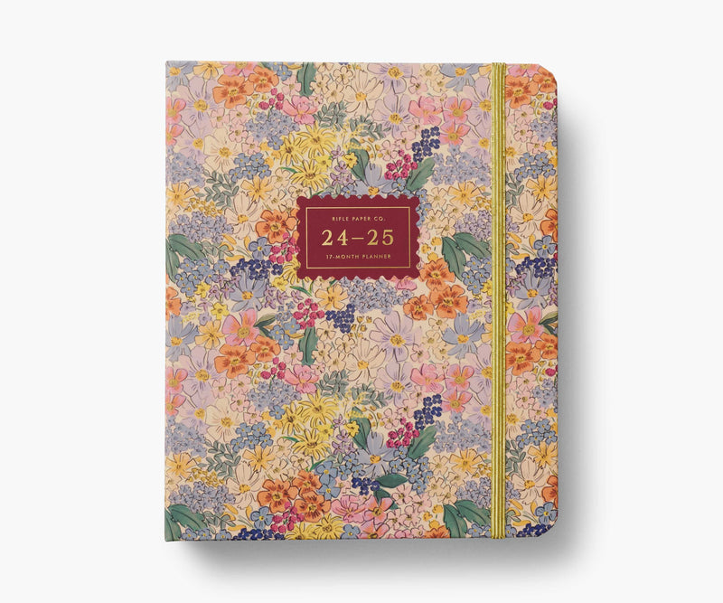Rifle Paper Co. Mimi 2024–2025 planner with floral cover, gold foil accents, weekly and monthly views, stickers, and storage folders.