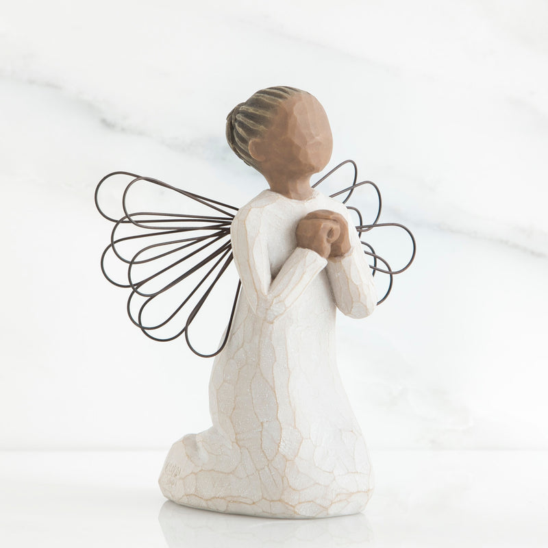 Angel of the Spirit figurine with darker skin tone, kneeling in prayer with wire wings and cream dress.
