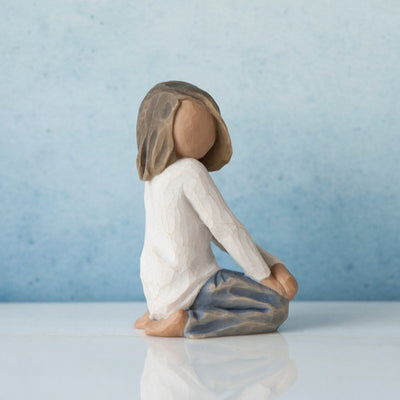 Willow Tree Joyful Child figurine of kneeling girl with darker skin tone and hair.