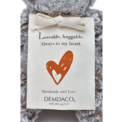 Small beige plush bear with a heart-shaped patch and a "Love" message, soft fabric, 8.5 inches tall, perfect for gifting.

