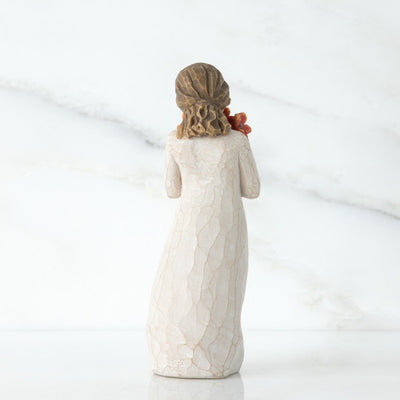 Willow Tree Surrounded by Love figurine holding red-orange poppy bouquet.