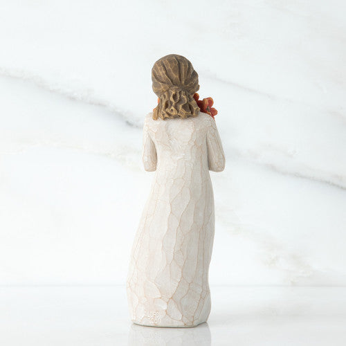 Willow Tree Surrounded by Love figurine holding red-orange poppy bouquet.
