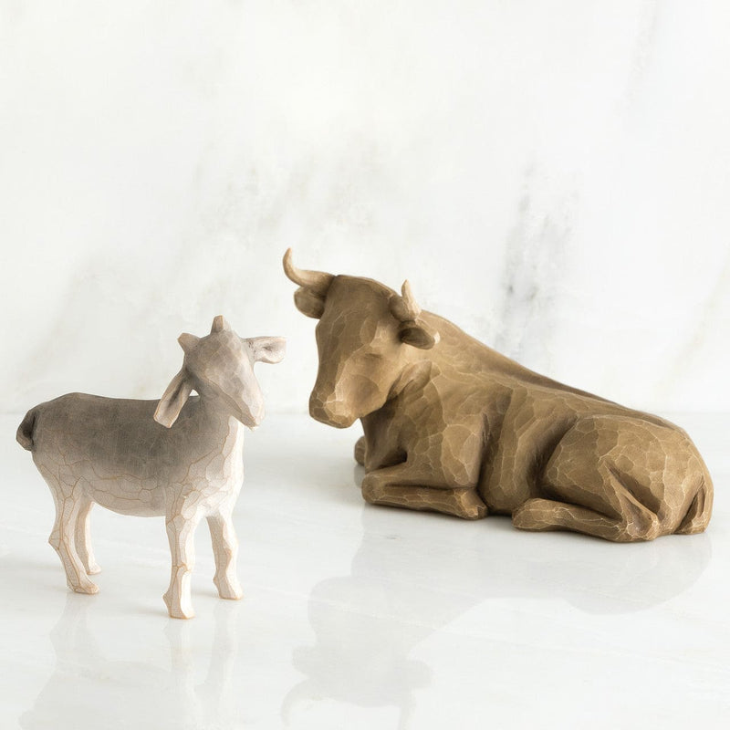 Willow Tree Ox and Goat figurines by Susan Lordi in neutral tones, part of nativity collection.