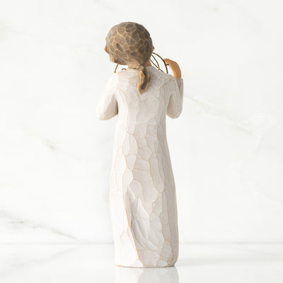 Willow Tree Love You figurine holding gold wire circle with message.